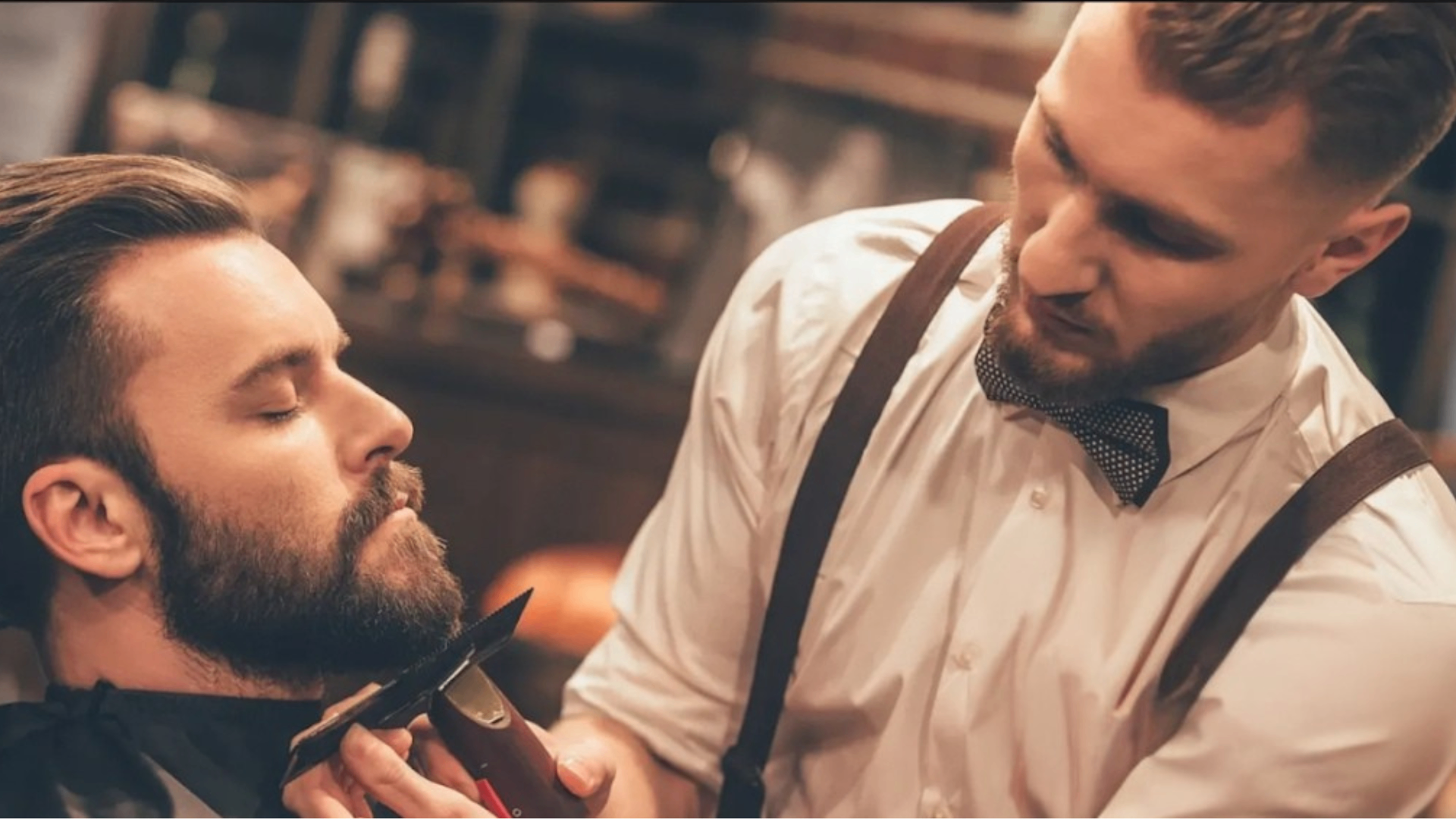 Master barber giving a beard trim at Lincoln Barber